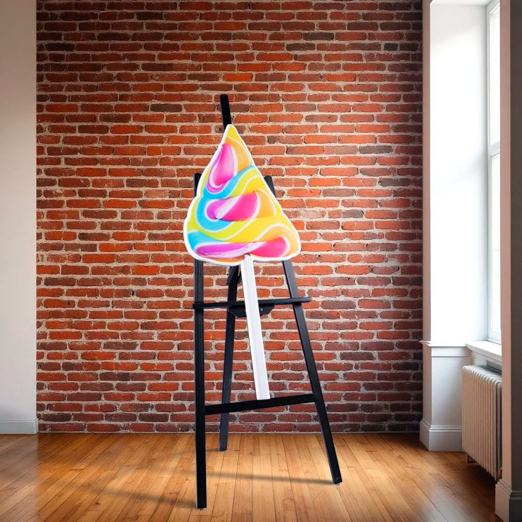 bright pink, blue and yellow lollipop - photographic sculpture wall art by Rory Fink – limited edition shaped print sitting on easel