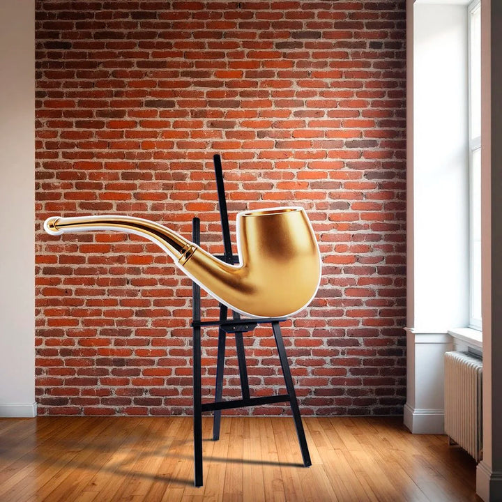 Gold pipe photographic wall sculpture by Rory Fink – fashion pop art sitting on easel